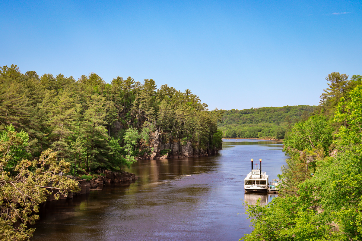 A historic paddle boat moves down the St. Croix River, one of the best things to do in Chisago Lakes with kids.