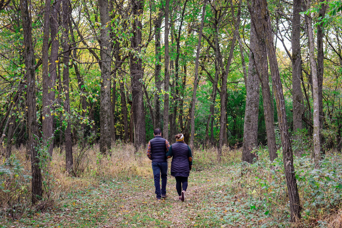 A couple walks along a trail in Flandrau State Park.