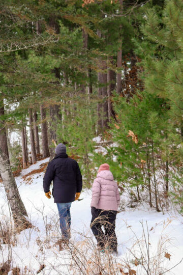 A father and his young daughter hike near Grand Rapids, Minnesota.