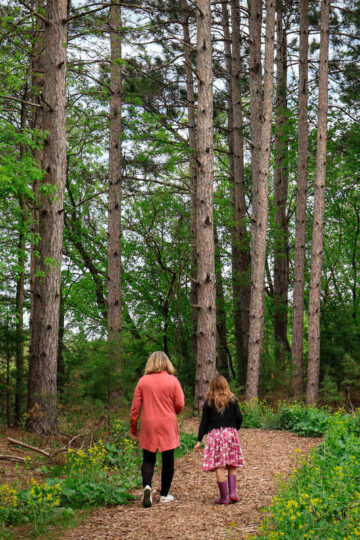 A woman and her granddaughter hike in Allemansrätt Park.